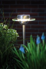 Stainless steel garden light with round glass ring and warm white LED for outdoor use.