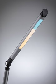 Modern grey metal LED desk lamp with adjustable warm and cool light for office use.