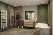 Modernes Badezimmer mit grün gestrichenen Wänden, Holzoptik-Fliesen, Badewanne und Glasdusche