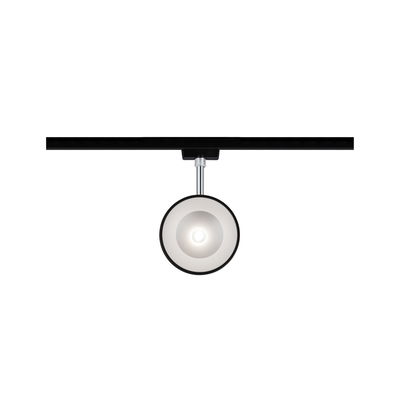 Modern round LED spotlight in black and silver on black track for flexible room lighting