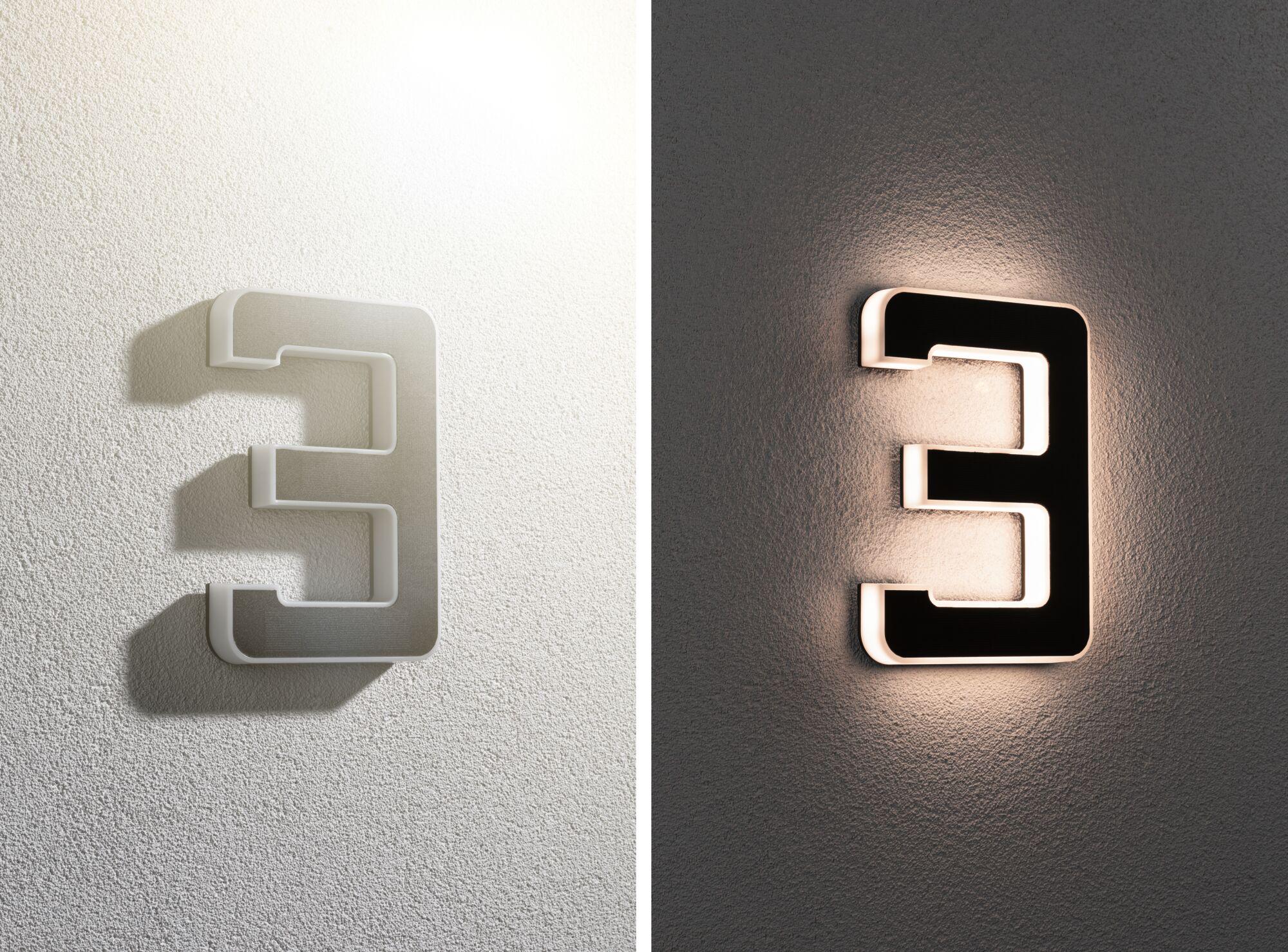 Modernes LED-Wandlicht in Form der Zahl 3 aus schwarzem und weißem Kunststoff mit indirekter Beleuchtung.