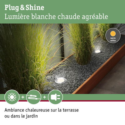 Lumières encastrées LED Plug & Shine blanc chaud dans lit de gravier gris avec cadre en bois pour jardin
