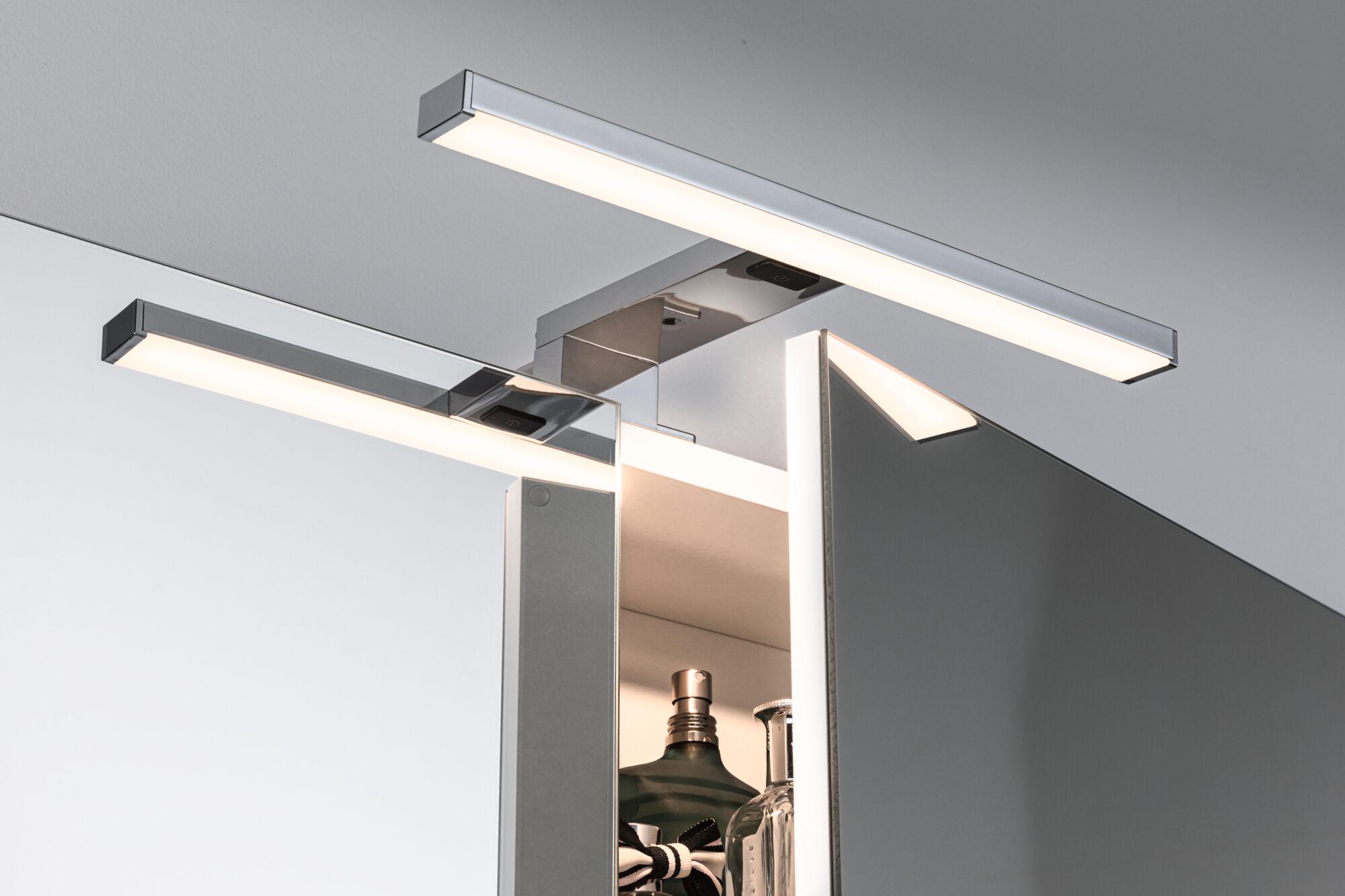 Modern chrome LED mirror light with warm white illumination for bathroom and living space