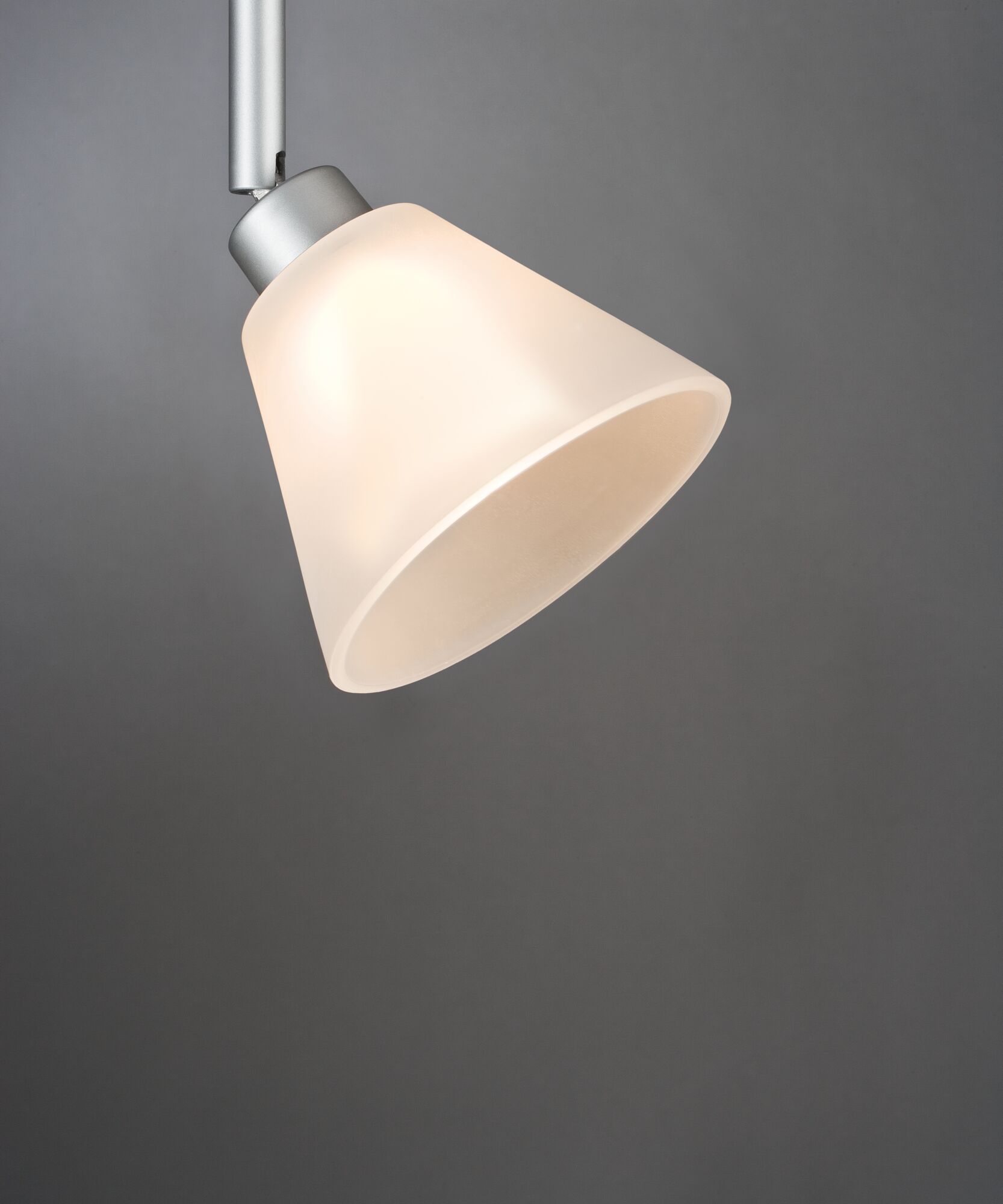 Modern ceiling spotlight with matte white glass and silver metal arm for focused lighting