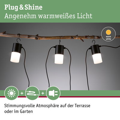 Drei schwarze Plug & Shine LED-Leuchten mit warmweißem Licht an Ast für Garten- und Terrassenbeleuchtung