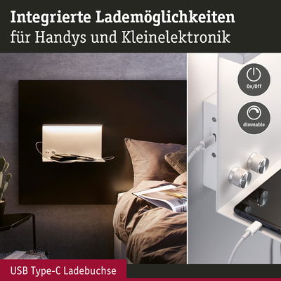 Weiße Wandlampe mit integriertem USB Type-C Ladeanschluss und dimmbarer Beleuchtung neben Bett.