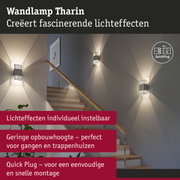 Moderne grijze metalen wandlamp Tharin met fascinerende lichteffecten op trapwand