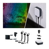 Éclairage de jardin extérieur avec trois projecteurs à piquer LED noirs et unité de contrôle pour effets lumineux colorés