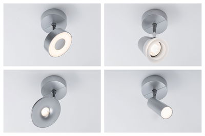 Vier moderne Deckenstrahler aus mattem Aluminium in Silber mit verschiedenen Leuchtendesigns für Wohnräume