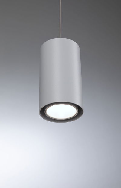 Modern cylindrical ceiling pendant light in matte grey aluminum with LED illumination.