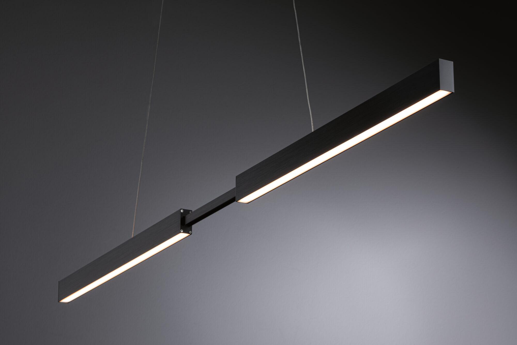 Black metal LED pendant light with warm white illumination for modern interiors