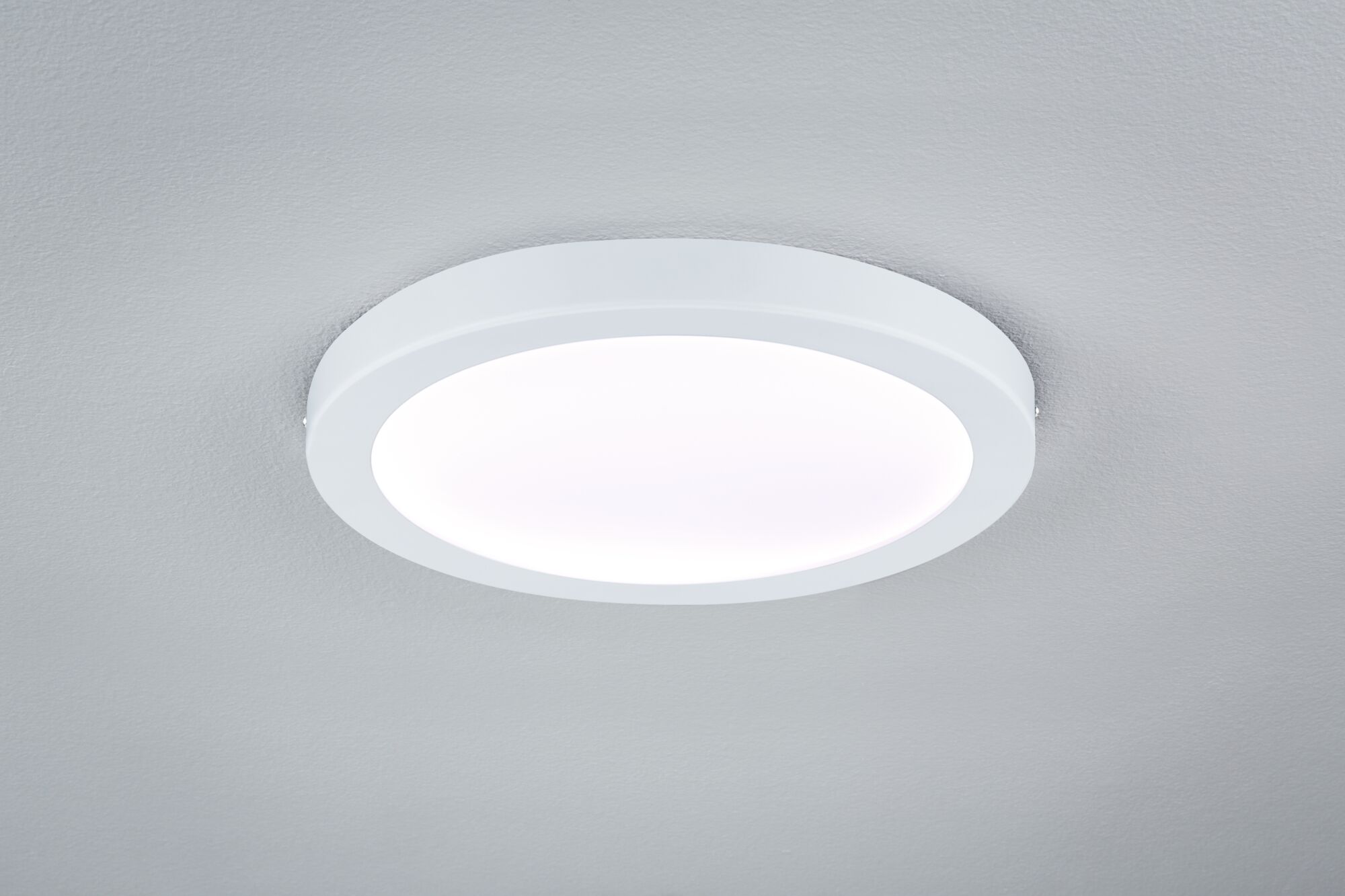 Round white LED ceiling light with matte plastic frame for modern room lighting
