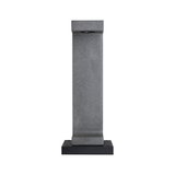 Grey concrete outdoor light post with black metal base for garden lighting