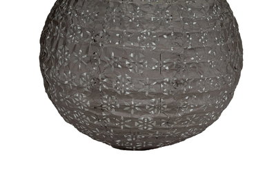 Round grey paper lampshade with floral cutouts for decorative lighting effect