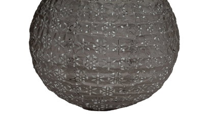 Round grey paper lampshade with floral cutouts for decorative lighting effect