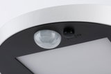 Close-up of white and black LED ceiling light with motion sensor and on/off switch