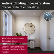 Moderne badkamer met ronde spiegel en witte wastafel, zwarte aluminium armatuur