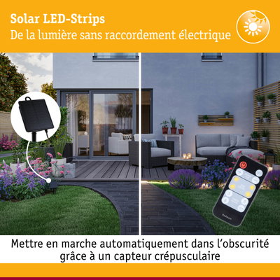Bandeaux LED solaires avec panneau solaire noir et télécommande dans un jardin avec terrasse et plantes
