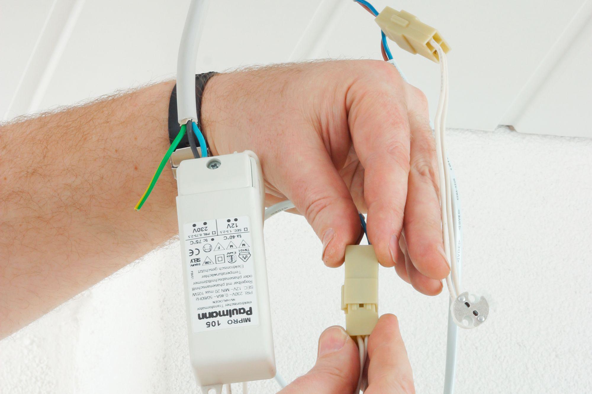 White plastic electronic transformer with wiring and connector for LED lighting installation