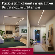 Flexible Linion light channel system with modular warm white LED ceiling lights in modern living room.