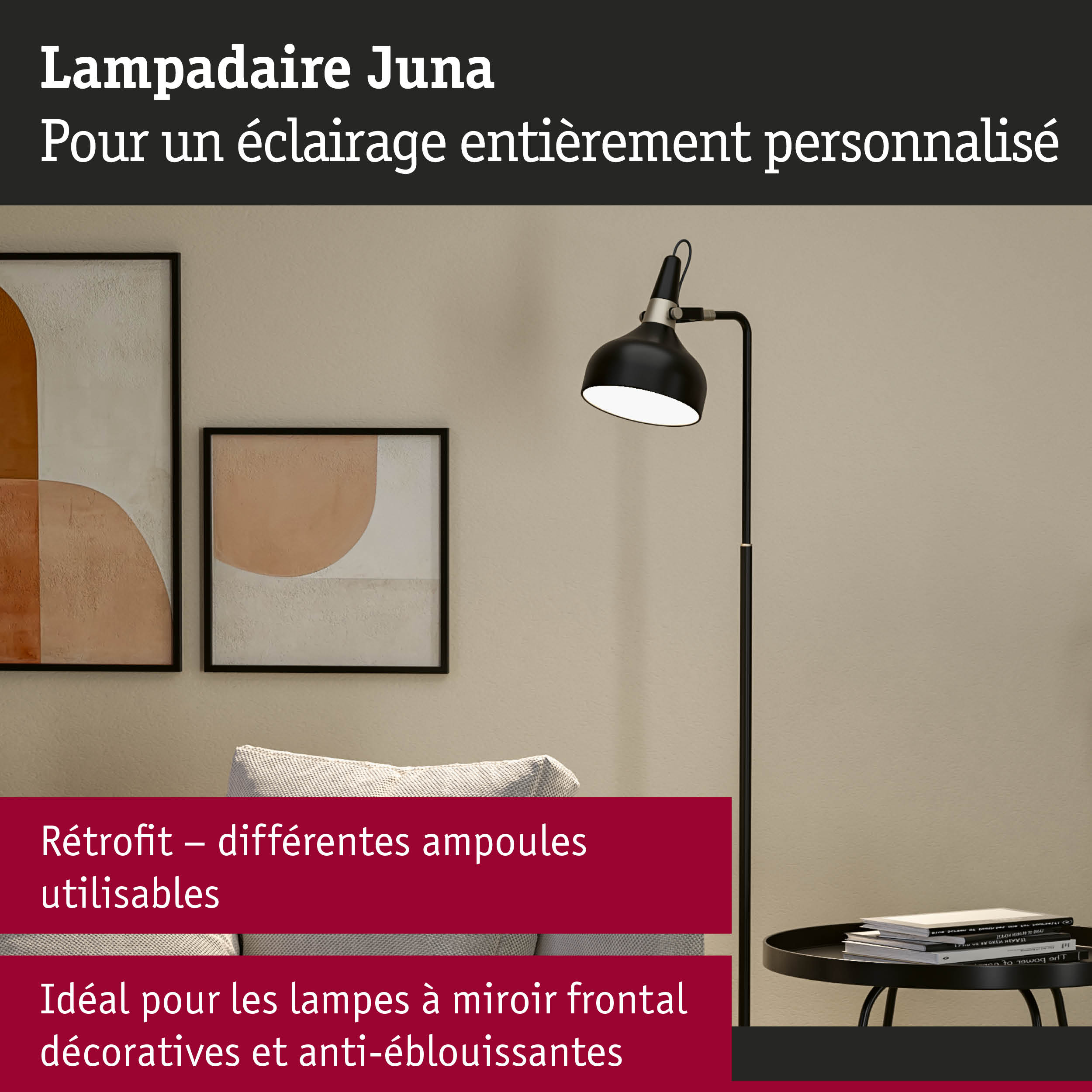 Lampadaire noir Juna avec abat-jour réglable à côté d'œuvres murales abstraites dans un salon moderne