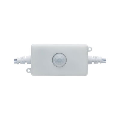 White plastic housing with integrated motion sensor and cable connections for light control