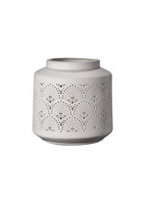 White ceramic lantern holder with delicate perforated patterns for ambient lighting