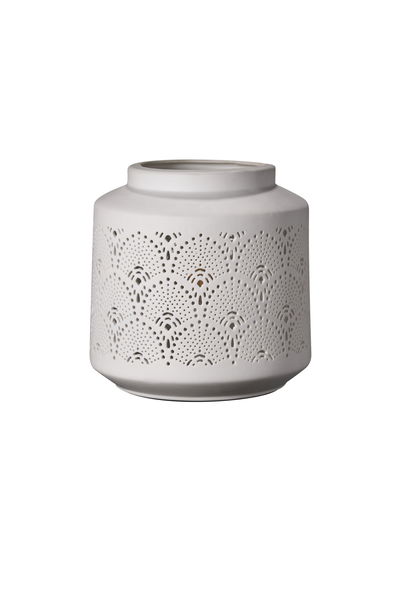 White ceramic lantern holder with delicate perforated patterns for ambient lighting