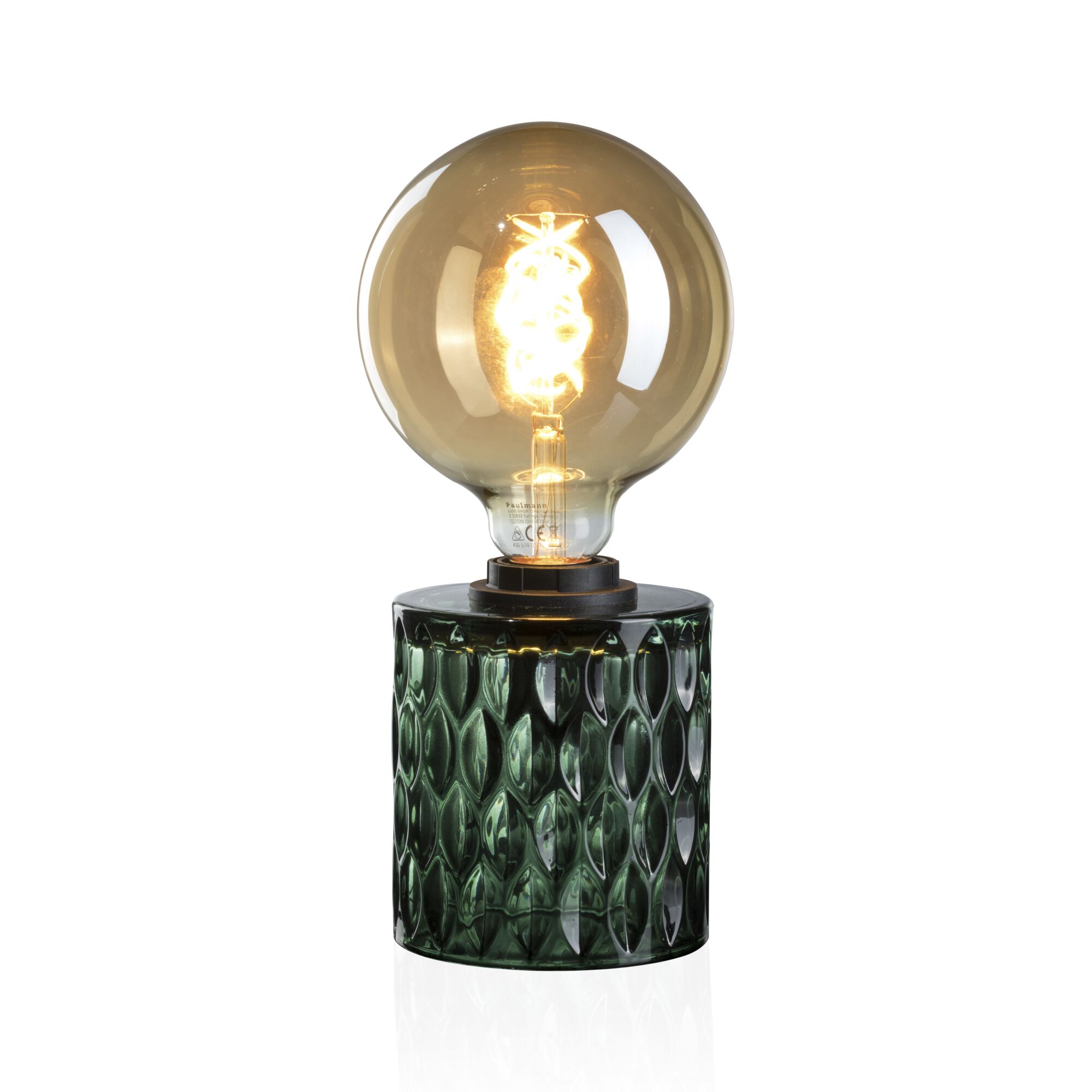 Table lamp with green glass base and large warm white LED bulb for ambient lighting in living spaces