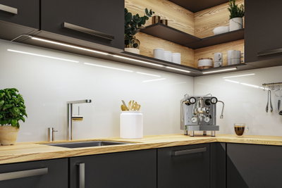 Modern kitchen with wooden countertop, stainless steel faucet, and LED under-cabinet lights for bright workspace.
