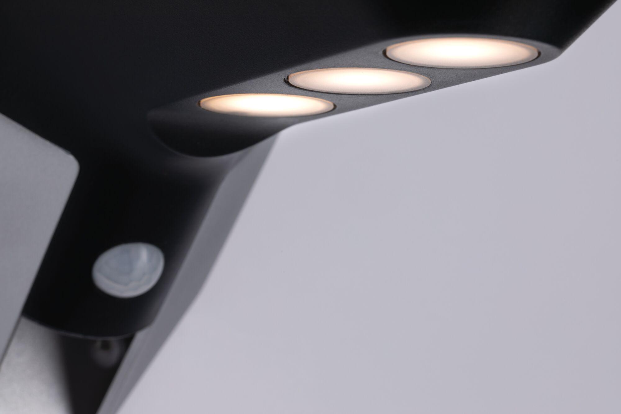 Black recessed LED light with three warm white bulbs, modern indoor lighting fixture