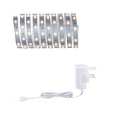 Flexible LED strip with warm white lights and white power adapter for versatile lighting solutions.