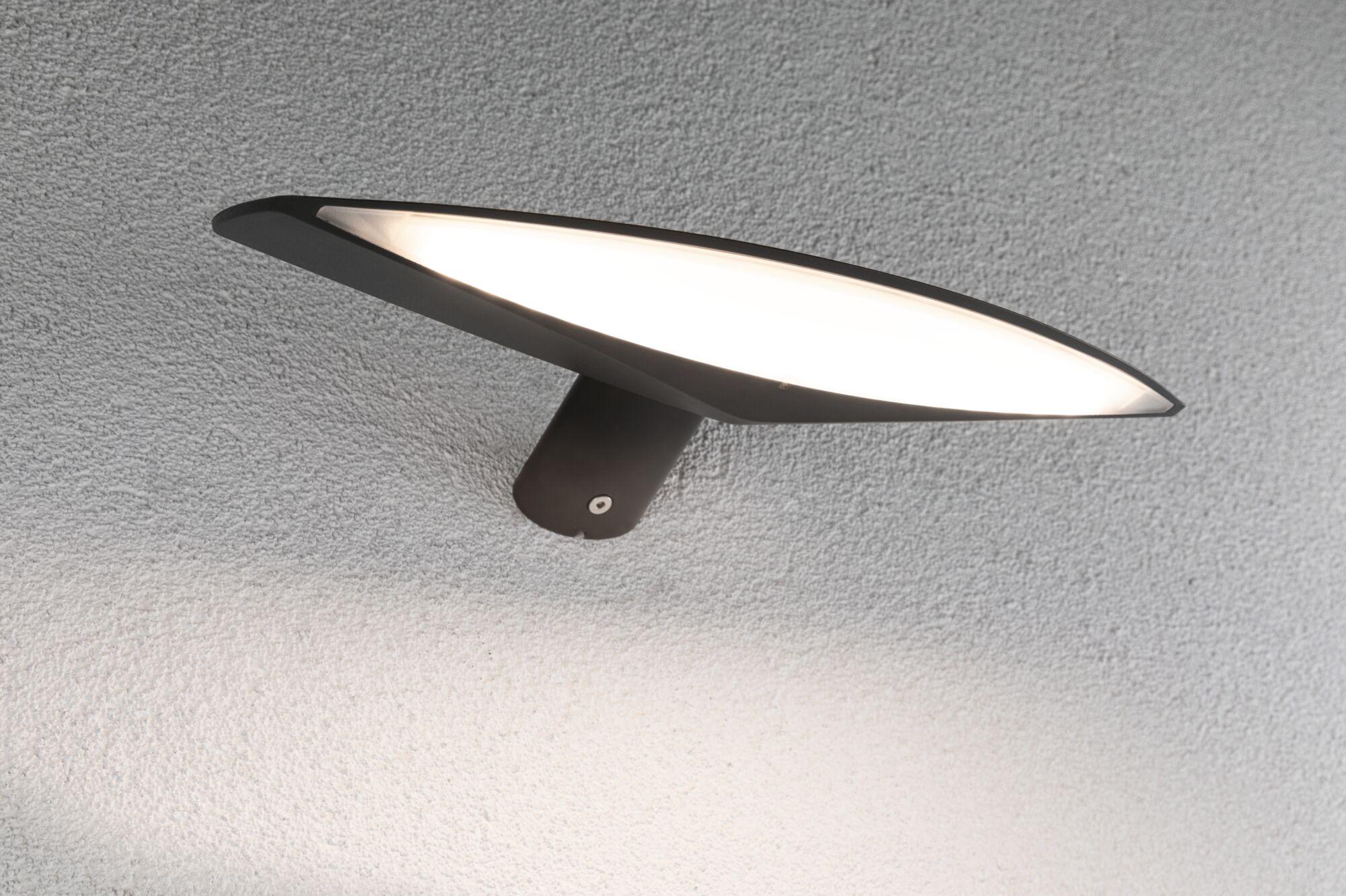 Black metal LED wall light with wide flat panel for modern outdoor lighting solutions