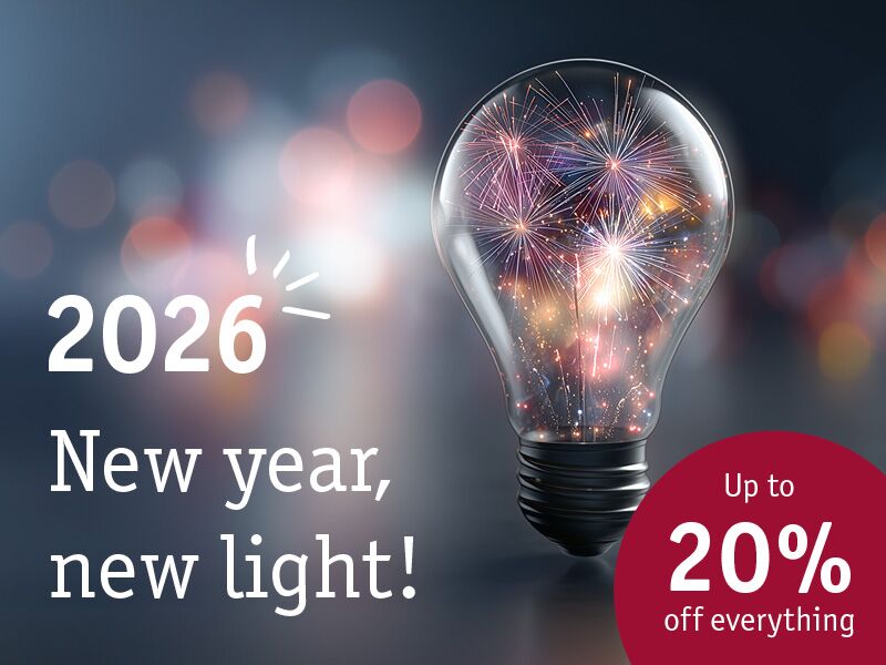 Light bulb with fireworks inside symbolising new light 2026 and up to 20% off lighting products