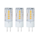 Three transparent LED bulbs with white bases and yellow diodes for energy-efficient lighting solutions