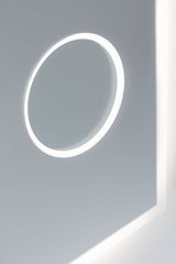 Modern LED wall mirror with round light ring and white frame for stylish room lighting