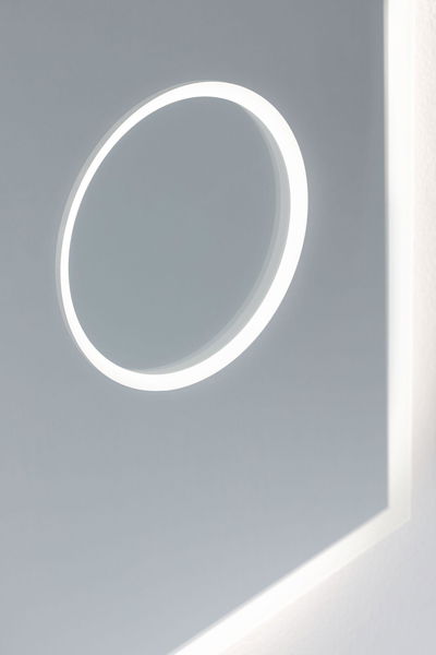 Modern LED wall mirror with round light ring and white frame for stylish room lighting