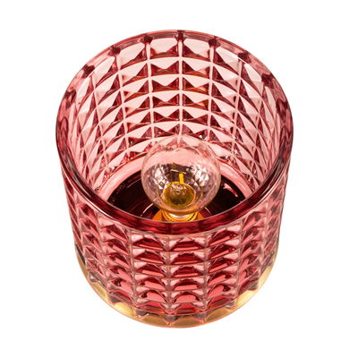 Rote Glas-Tischleuchte mit facettiertem Muster und sichtbarer Glühbirne für dekorative Beleuchtung