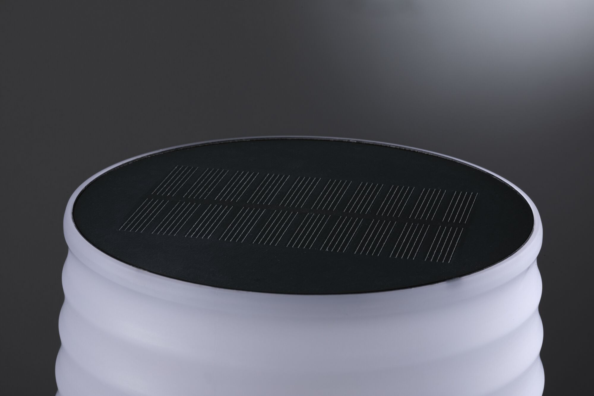 White LED solar light with black solar panel on top, energy-saving outdoor lighting