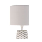 Table lamp with grey fabric shade and white patterned ceramic base for home lighting