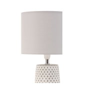 Table lamp with grey fabric shade and white patterned ceramic base for home lighting