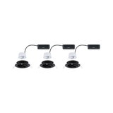 Three black recessed spotlights with white LED modules and connection boxes for modern LED lighting