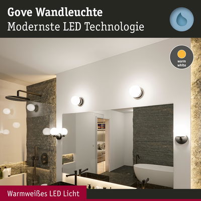 Gove Wandleuchte mit warmweißem LED-Licht in modernem Badezimmer mit Spiegel und Badewanne