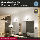 Gove Wandleuchte mit warmweißem LED-Licht in modernem Badezimmer mit Spiegel und Badewanne