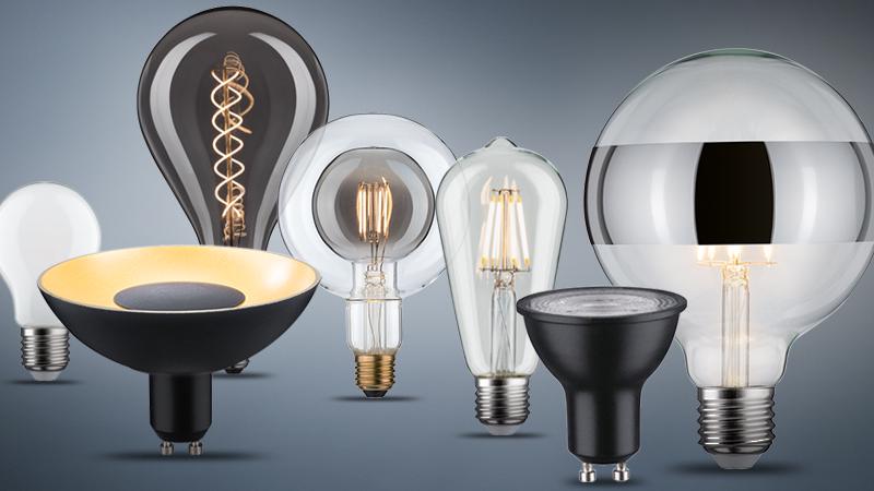 Various LED light bulbs in clear and black designs for energy-efficient lighting solutions.