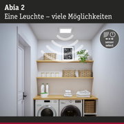 Abia 2 LED-Deckenleuchte in Weiß mit Sensorfunktion über Waschmaschine und Regalen im Hauswirtschaftsraum