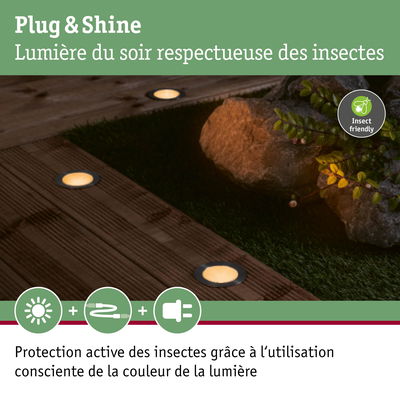 Éclairage LED Plug & Shine blanc chaud au sol sur terrasse en bois respectueux des insectes