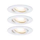 Three white plastic recessed spotlights with warm white light for modern indoor lighting