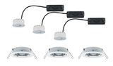 Three white LED recessed spotlights with black connection boxes and metal springs for ceiling mounting