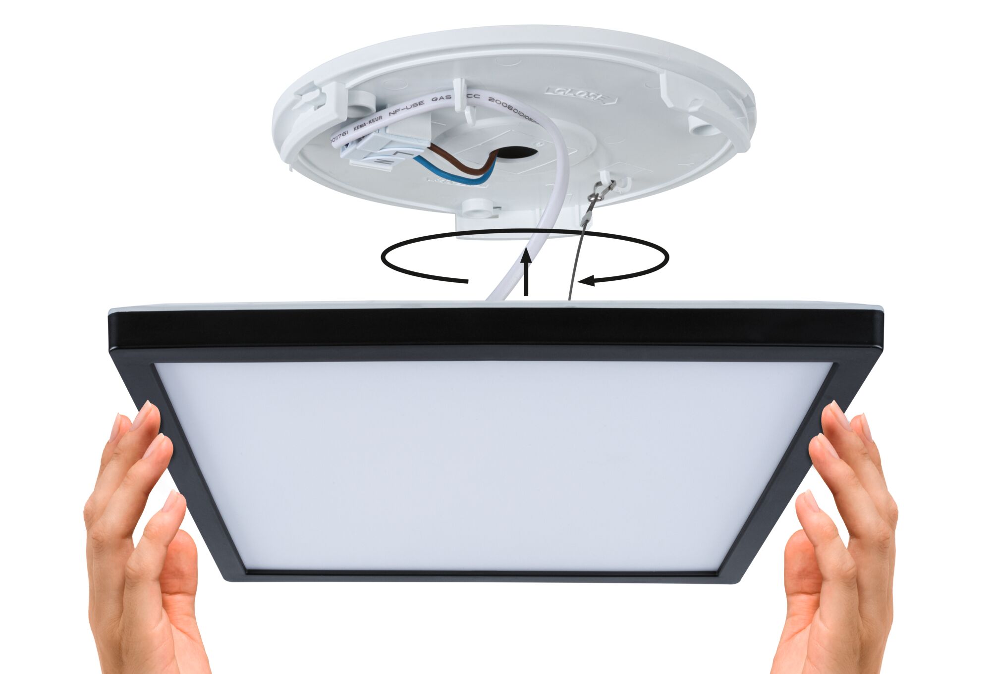 Installation of square LED ceiling panel light with black frame and white diffuser surface.